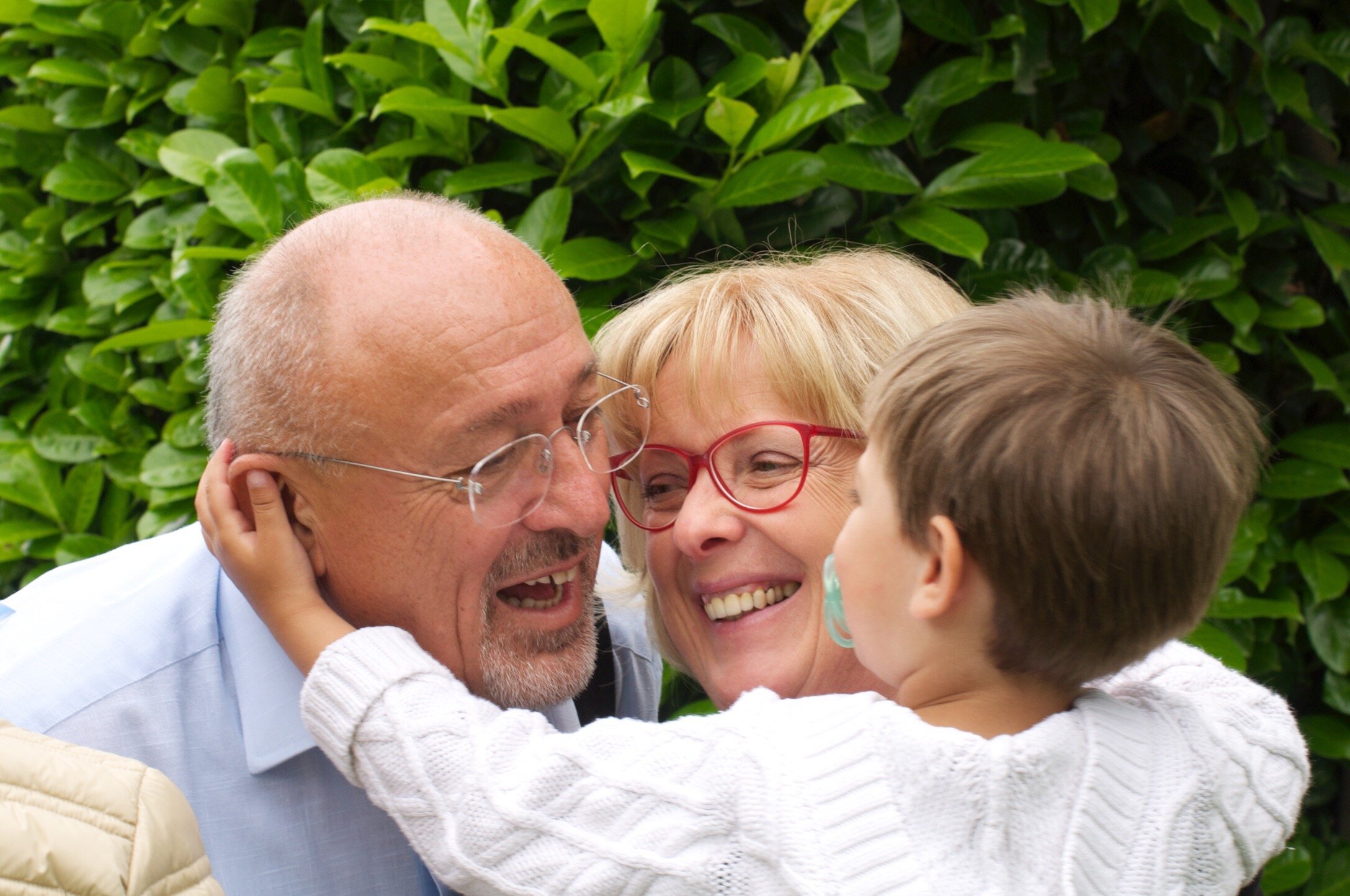 Grandparents hold grandson